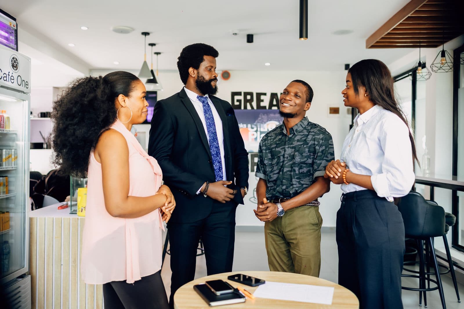 Colleagues talking in a Lagos office